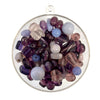 Glass beads in assorted sizes and shape in purple tones.