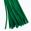A bundle of green chenille stems or craft pipe cleaners arranged diagonally on a plain white background.