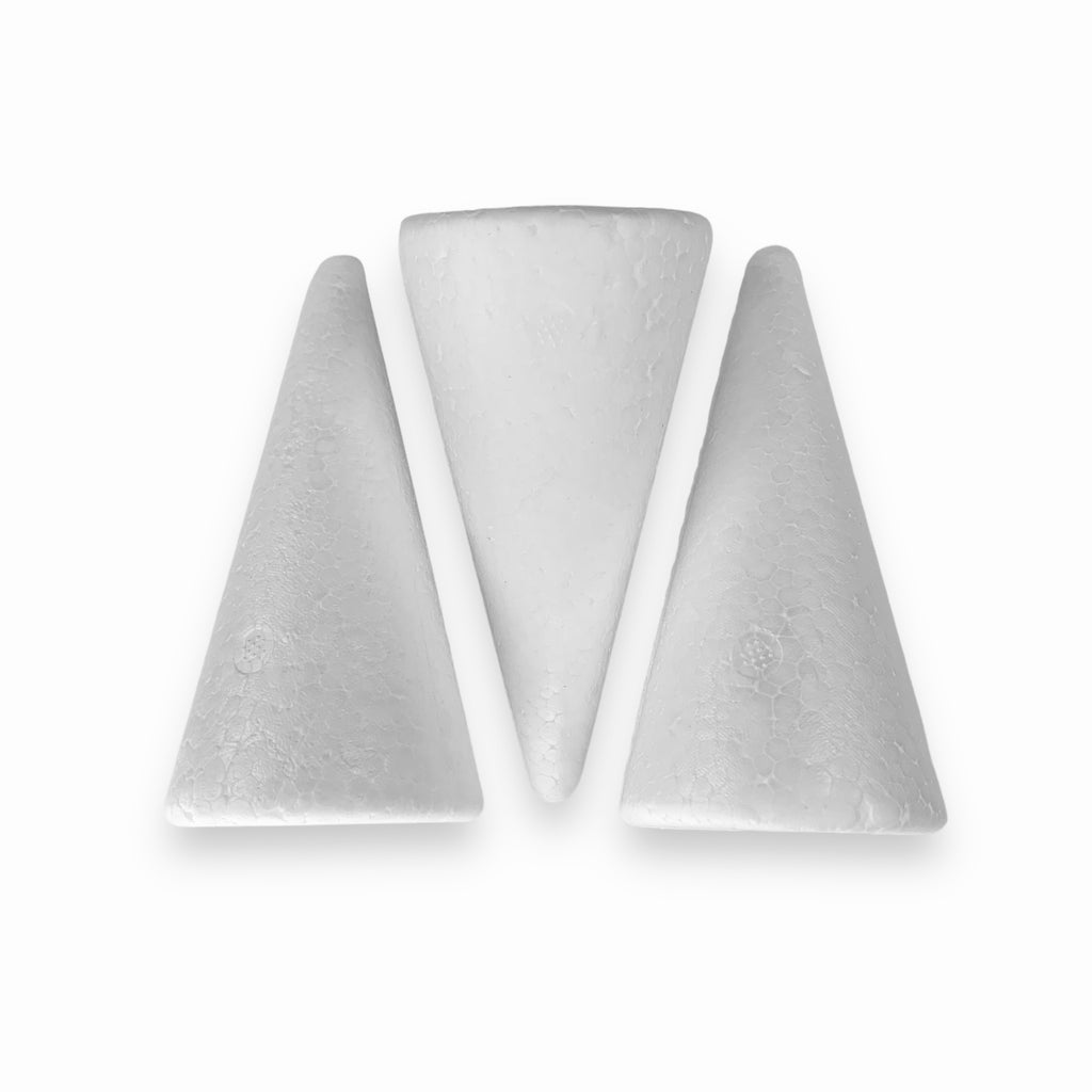 Three white polystyrene cones placed on a white background.