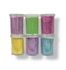 Six clear plastic vials filled with ultra fine glitter in assorted colors, arranged in two rows of three on a white background. The glitter colors include lilac, light green, hot pink, lemon, pale pink and light blue.