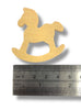 Wooden rocking horse toy next to a ruler for scale on a white background