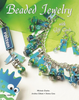 A book titled 'Beaded Jewellery' showcasing various beaded jewelry items including a bracelet, necklace, and earrings with a predominantly green and blue color scheme, and silver-colored beads and findings.
