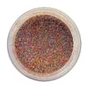 Top-down view of a clear round plastic jar filled with fine multi coloured glitter powder, showing a multicolor rainbow sheen on a white background.