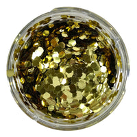A clear container filled with gold hexagonal chunky glitter.