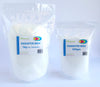Two bags of paraffin wax, one labeled as 1kg and the other as 500gm, both in white color with blue and green label.