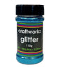 A jar of Craftworkz ultra fine glitter in aqua color, with a label indicating 113g weight and 0.2mm flake size.