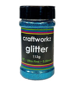 A jar of Craftworkz ultra fine glitter in aqua color, with a label indicating 113g weight and 0.2mm flake size.