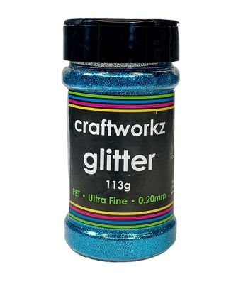 A jar of Craftworkz ultra fine glitter in aqua color, with a label indicating 113g weight and 0.2mm flake size.