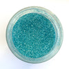 A jar of Craftworkz ultra fine glitter in light blue.