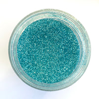 A jar of Craftworkz ultra fine glitter in light blue.
