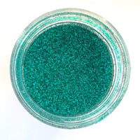 A jar of Craftworkz brand ultra fine glitter in turquoise.